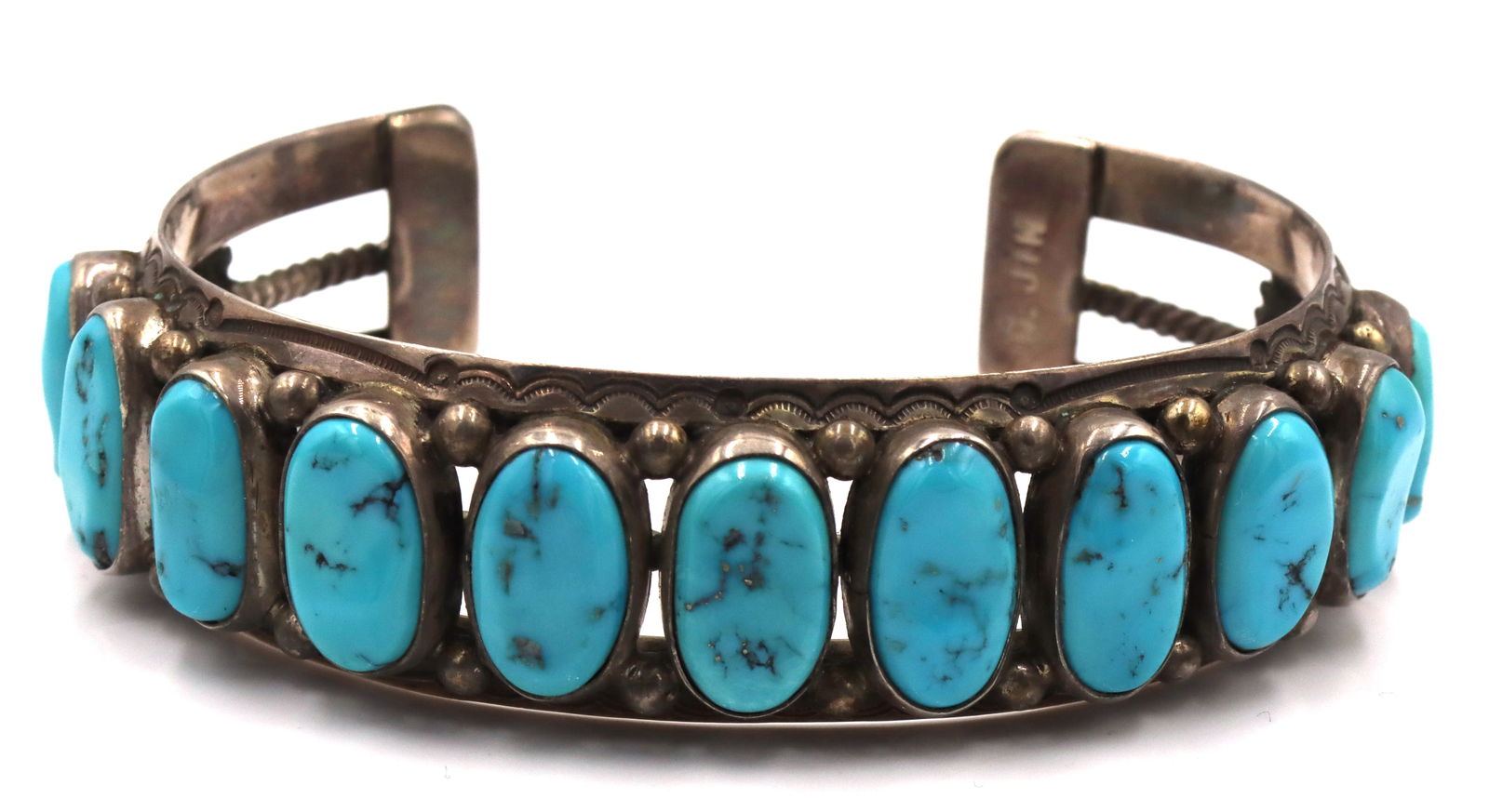Vintage 925 sterling silver signed Turquoise cuff bangle: Vintage 925 sterling silver signed oval Turquoise cuff bangle. The total weight of the bangle is 56.9 grams.