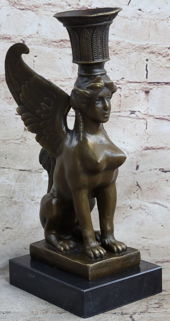 Nude Sphinx Candle Holder Bronze Figurine: A fine hand-tooled bronze created from wax casting and finished in a dark brown polish enhances the beauty of the art. Her skin tones with a golden bronze finish, her voluptuous figure is accented by