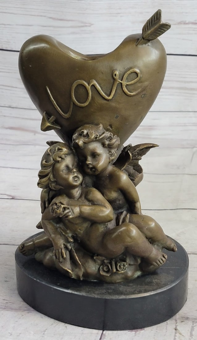 Be my Valentine Candle Holder Bronze Statue: Use some love to spruce your very special day with these love de candleholders love bronze sculpture has a marble base. Perfect for completing your wedding, anniversary, sweet sixteen, bridal shower,