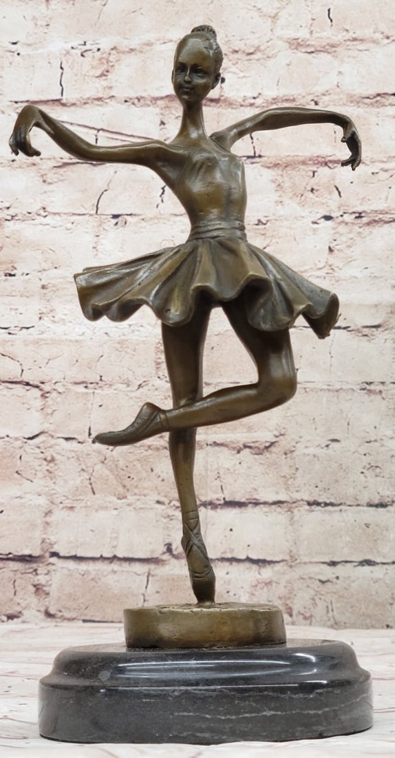Bird Ballerina Dancer Bronze Statue: The ballerina stands tall and elegant as she looks to the heights of the balcony lovingly admiring the audience. She wears a tiara and a modern tutu, the classic costume of the ballet dance, which has