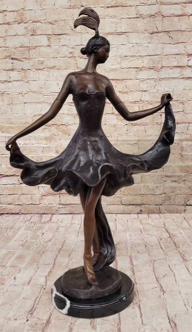 Dancer Bronze Figurine: The brown flesh tones are actually the amazing applications of a patina blend over bronze. Cast in Europe using the lost wax method. Notice the authenticity of this recast of the original sculpture by