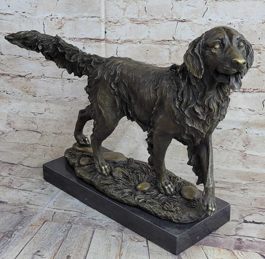 Golden Retriever Bronze Sculpture: The Golden Retriever can be imagined stepping out of a lake, its fur water-drenched, as his eyes signal its owner to throw the ball one more time. His eyes stare unblinking waiting for the thrust of t