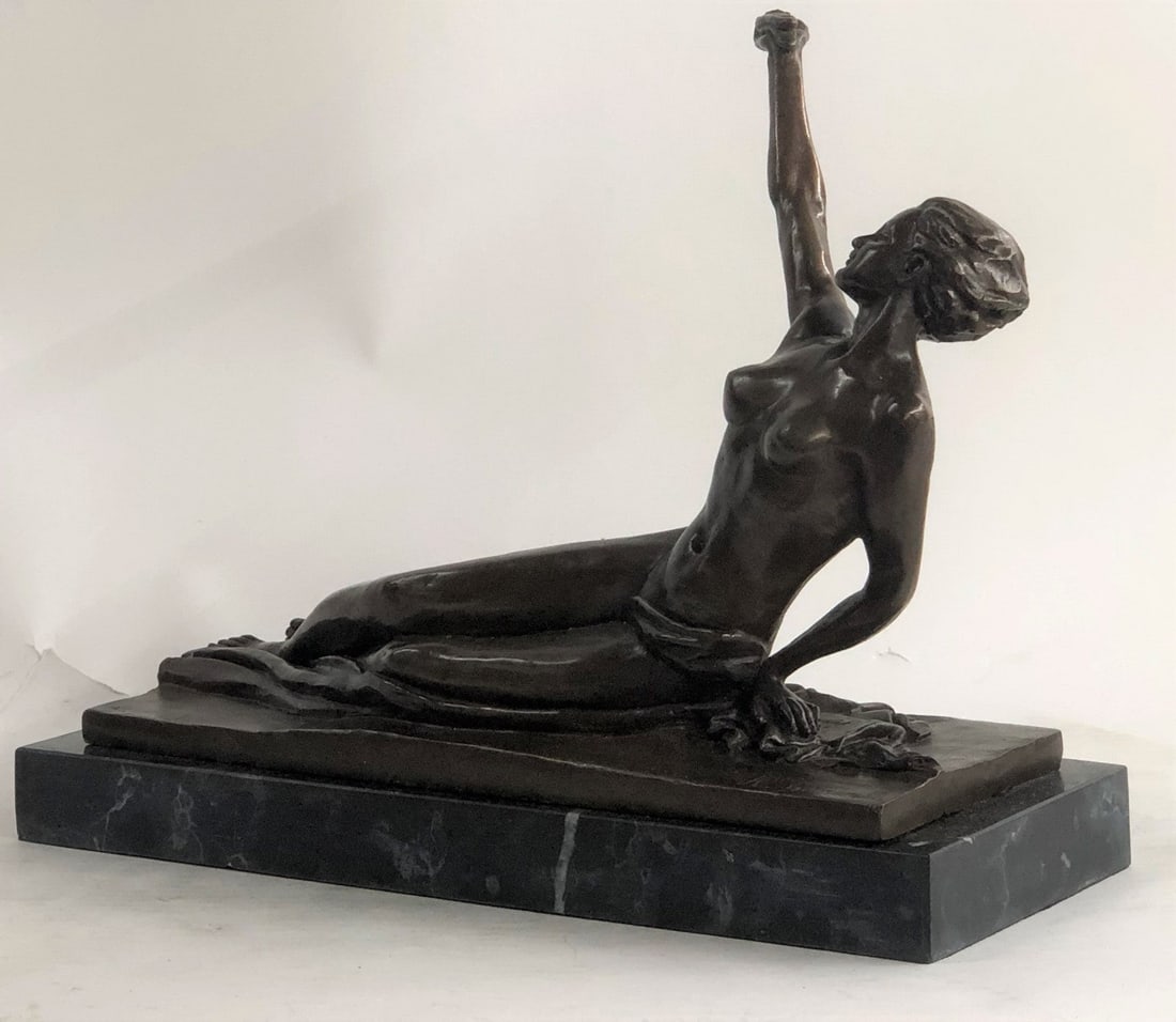 Nude Female Bronze Sculpture: This sculpture is a perfect beauty composition. The bronze figure portrays a nude Art Deco woman with a small bird in the hand of her extended arm and is ready to fly away. The sculpture can be descri