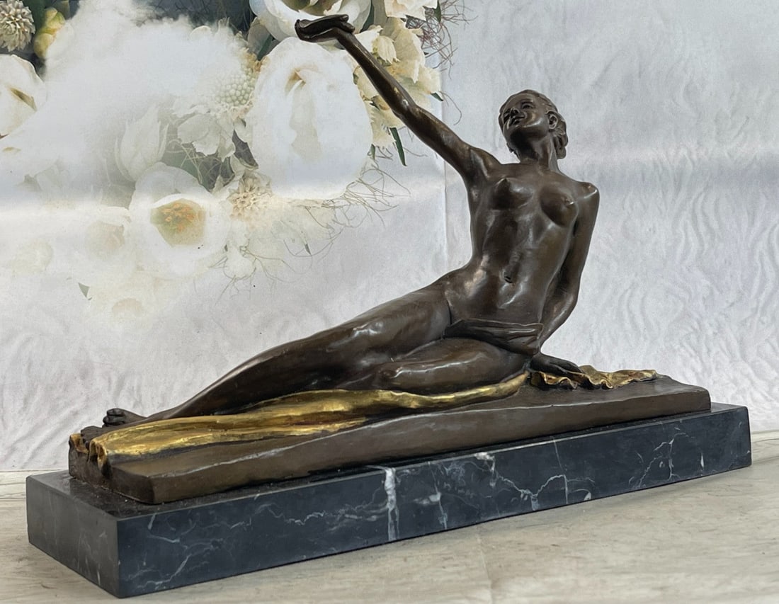 Nude Lady Bronze Sculpture: This sculpture is a perfect beauty composition. The bronze figure portrays a nude Art Deco woman with a small bird in the hand of her extended arm and is ready to fly away. The sculpture can be descri