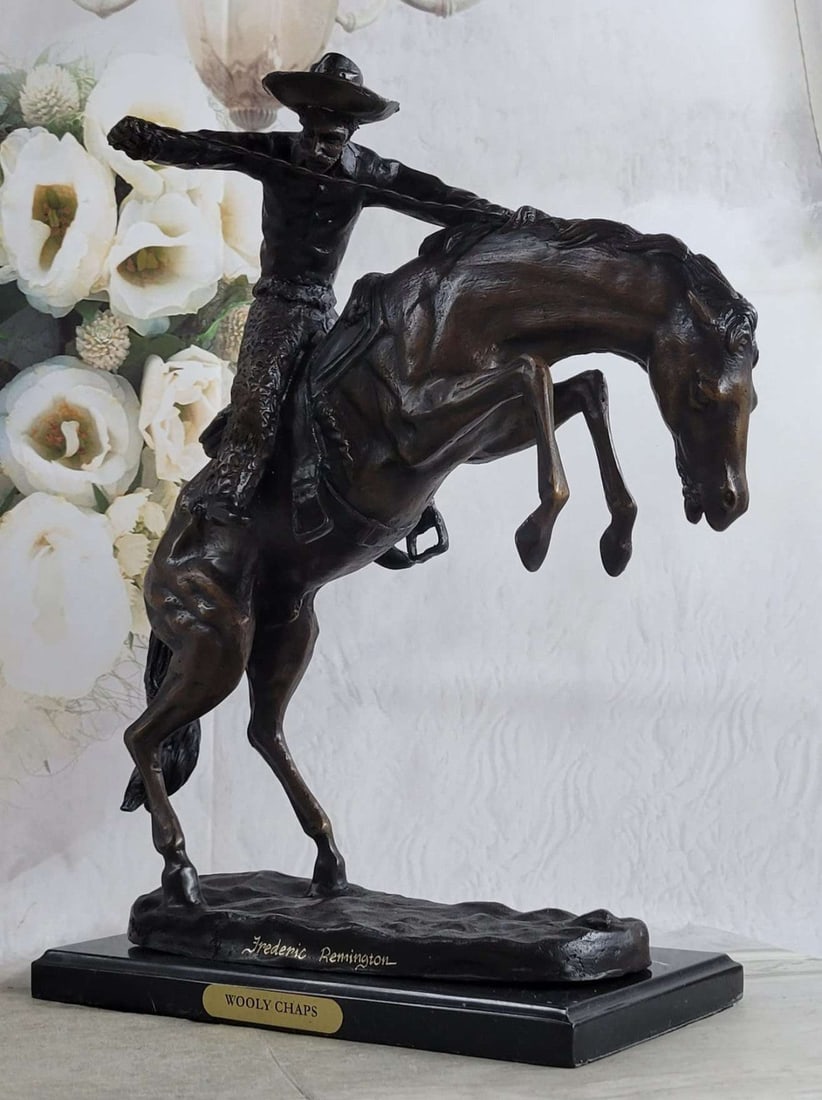 A Cowboy on Horse Woolly Chaps Bronze Sculpture: This Sculpture is very appealing to the eyes giving you dimension, depth, and capturing movement. This Sculpture has so many details that every time you look at it you are sure to find something new.