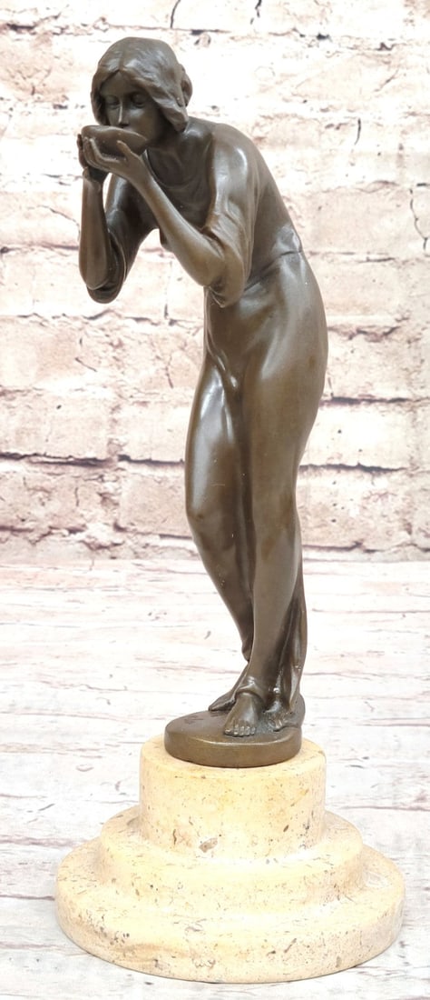 Hunched Woman Drinking Water Bronze Statue: This Figurine Depicts A Woman in A Hunched Position Drinking from A Bowl. She Wears A Gown That Drapes and Contours to Her Body and Fuses with The Base by Her Bare Feet. Her Hair Is Pulled Back Behind