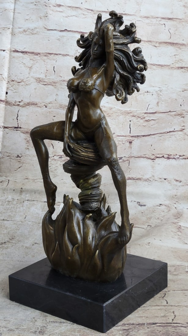 Woman Burst From Flame Bronze Sculpture: A sexy woman bursts from flames and appears resting seductively on a puff of smoke. Her body is a vision of sexuality and male fantasy. She has one arm over her hair that is as wild and wavy as the fl