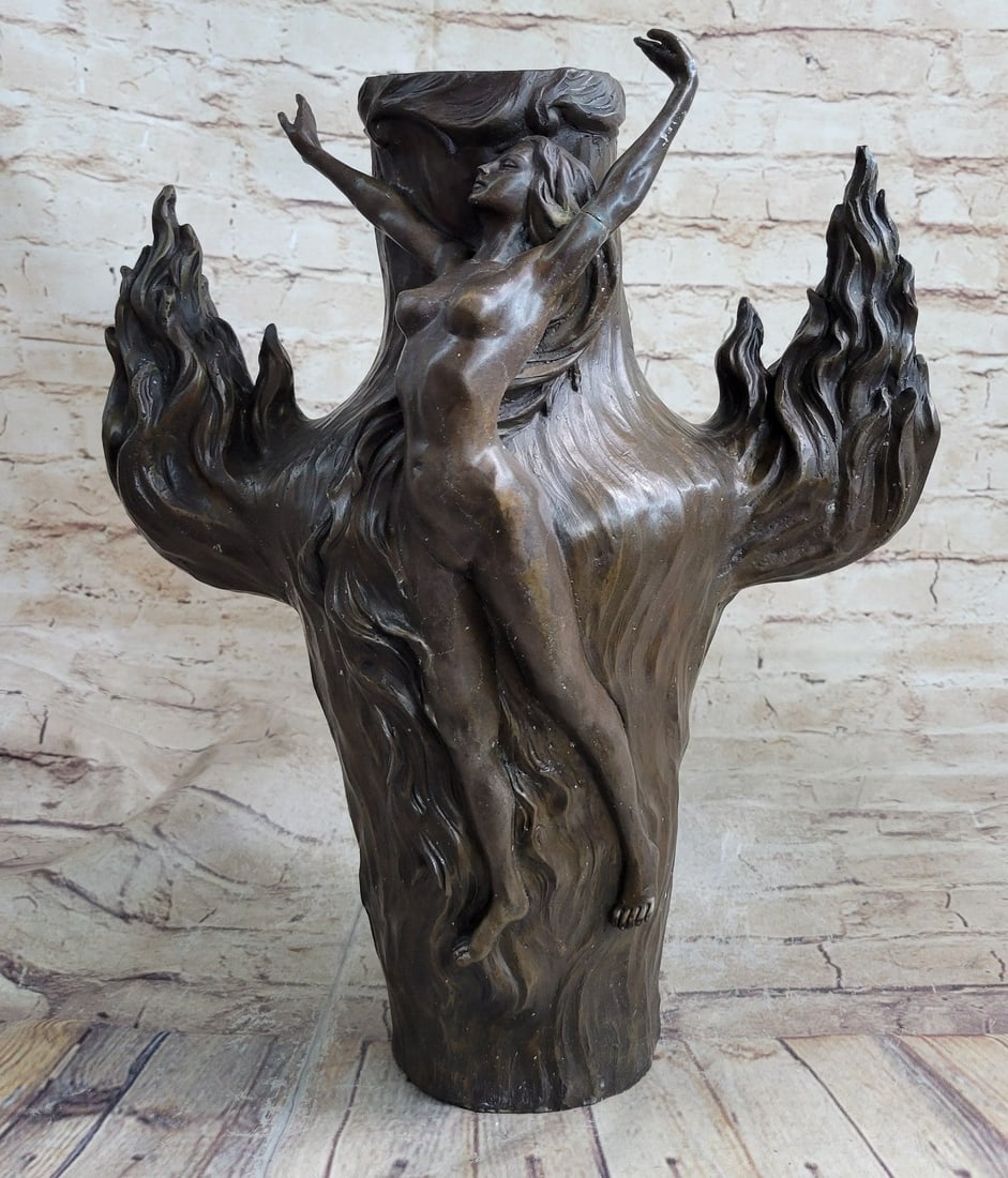 Nude Lady Girl Water Jug Bronze Sculpture: An exquisite vase that would be the center of attention in any room. A nude nymph surrounds the vase. The nymph seems to grow like blossoming flowers. Vines and flowers creep around her, almost a part