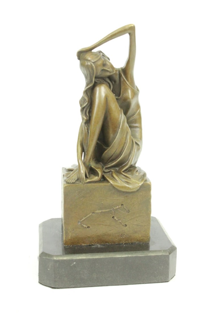 Sitting Woman Bronze Statue: The young woman sits pensively on a high rock. Her head rests on her hands as her gaze focuses downwards. She is dressed in semi-nude. A garment hangs from her arm and falls to her lap leaving her che