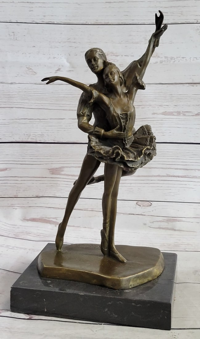 Ballerina Poised Dancer Bronze Sculpture: This graceful couple takes the stance in unison to impress the audience. They dance so beautifully and elegantly as his right arm holds around her stomach. Both her arms are lifted while his left arm