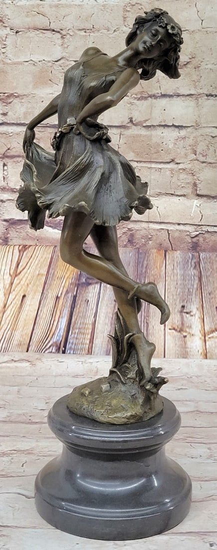 Dancer Bronze Sculpture: This astonishing piece of art is a magnificent art deco figurine. Her arms are outstretched to her side as she stands on one leg and balances, she is careful not to make a mistake during her performan