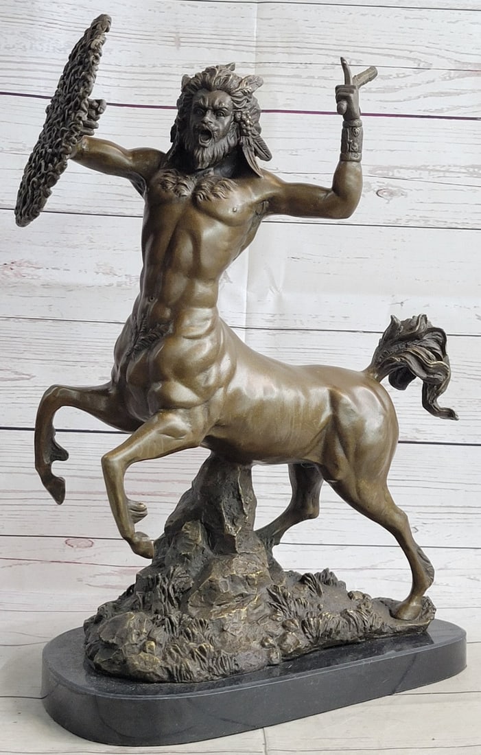 Centaur Bronze Sculpture: The powerful centaur comes barreling out of the realm of Greek mythology wielding a sword and shield of snakes in hand. His powerful hooves beat down on the ground as a yell of defiance rips through h