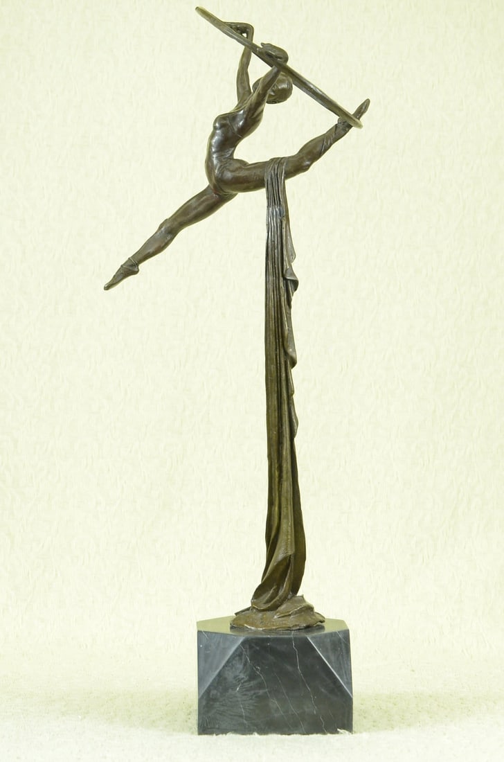 Gymnast Ballerina Bronze Sculpture: The beautiful Gymnast is seen leaping into the air as a fabric banner, coated in a vibrant brown patina, twines itself around her sculpted body. This work of art rejoices the female figure and shows a