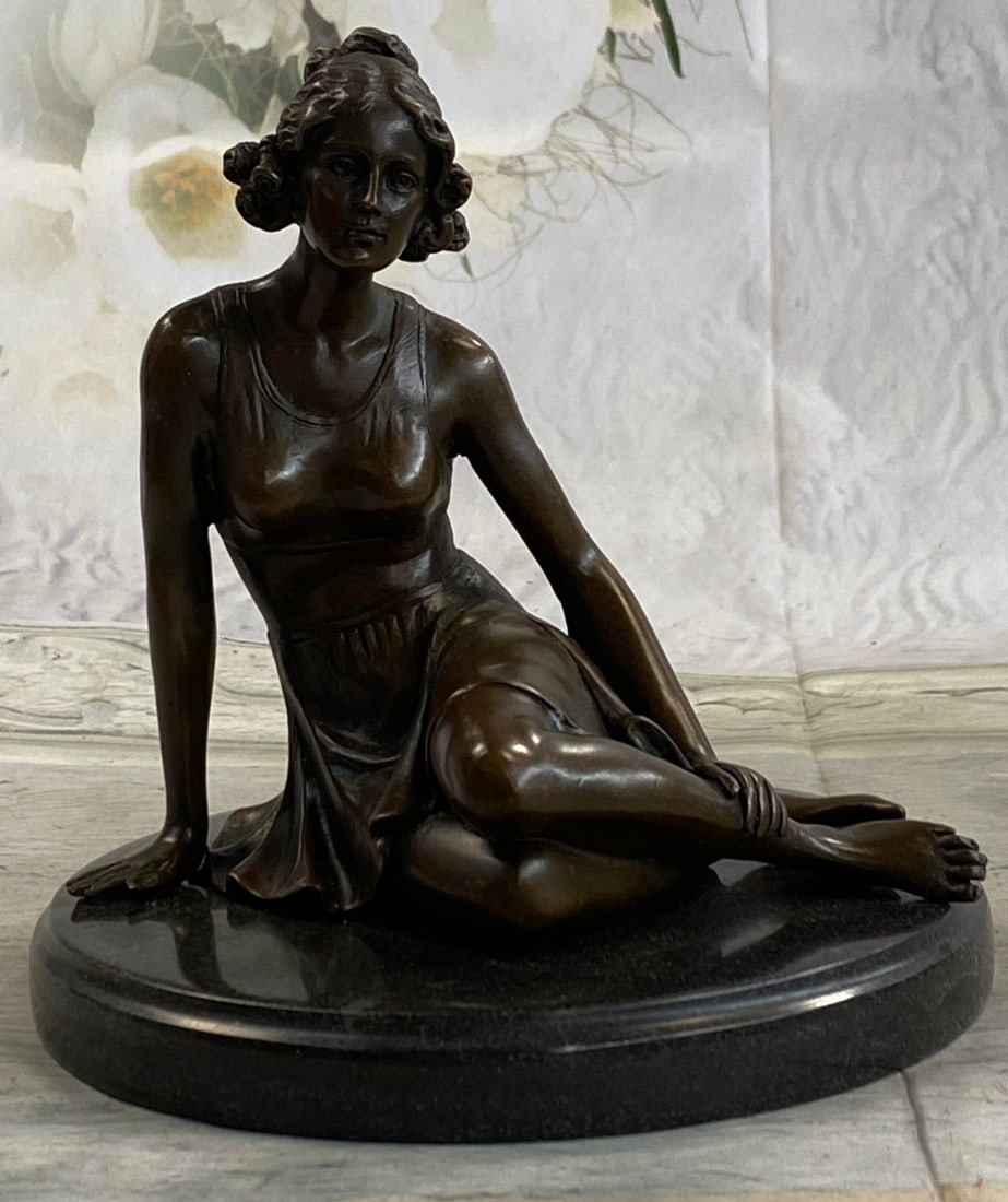 Elegant Woman Bronze Sculpture: She poses for a painting, sitting before his easel wearing nothing but her curves. She is a natural woman and she sits innocently awaiting his instruction. Her curly hair barely reaches her shoulders.