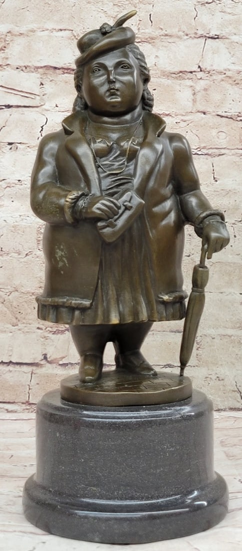 Woman Bronze Figurine: This stoic abstract woman goes out one cloudy afternoon to run a few errands. She is dressed in along sports jacket over a blouse and skirt. She wears a hat, which is tipped to the side. She clutches