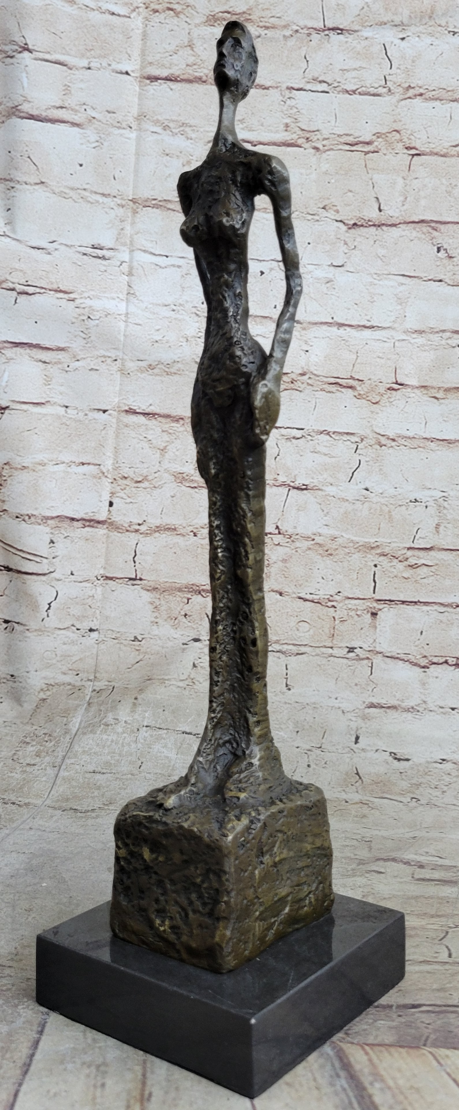Modern Female Bronze Sculpture: The basic motive remained the same, the women for Venice are all female nudes with adjacent arms. They are distinguished by the pointed foot sections. This massive emphasis of the substructure is in c