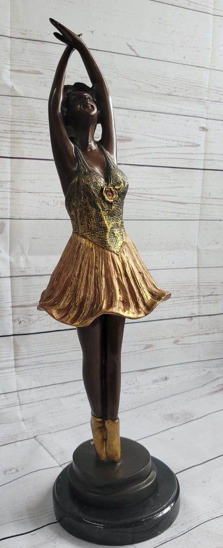 Tall Ballerina Dancer Bronze Sculpture: When you look over the sculpture and the depth and warmth of the patina meet your eye, it sends a sense of calmness and gracefulness. It is almost as if the sculpture is a picture of a lullaby in stil