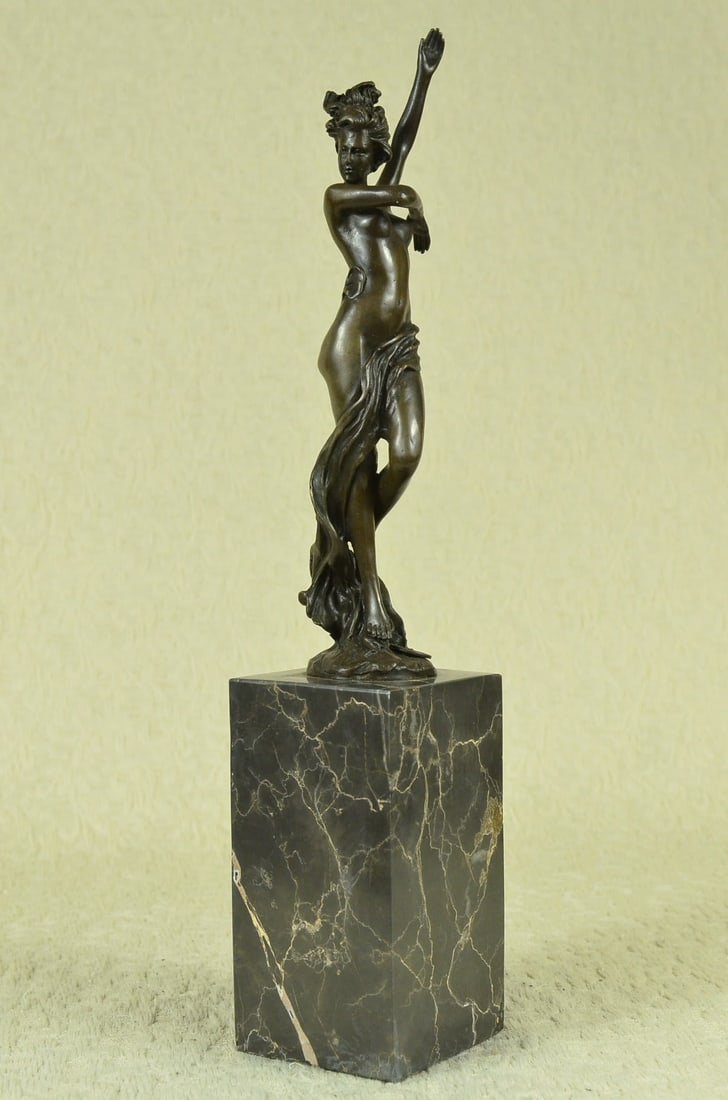 Sexy Girl Bronze Sculpture: Sexy, proud, and 100% confident, this beauty bares it all. She is no waif by any means, with round hips, curvy thighs, and full breast. She combs her fingers through her long hair and lets the strands