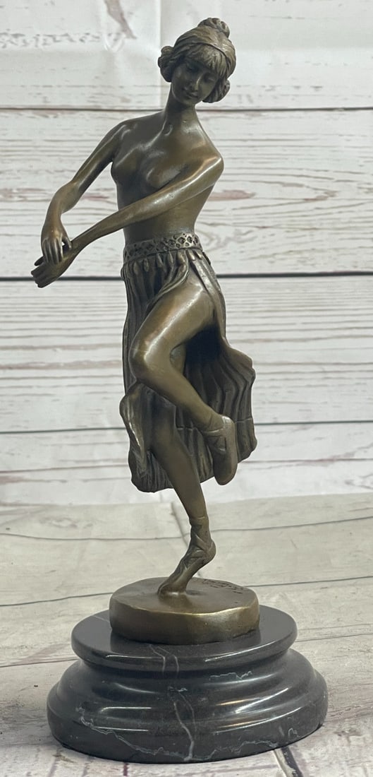 Lady Dancer Bronze Sculpture: Feeling of motion and excitement conveyed by dancers Costume, gesture and facial expression. Smooth quality chasing of figure. This Bronze Sculpture was crafted using the lost wax method and is set on