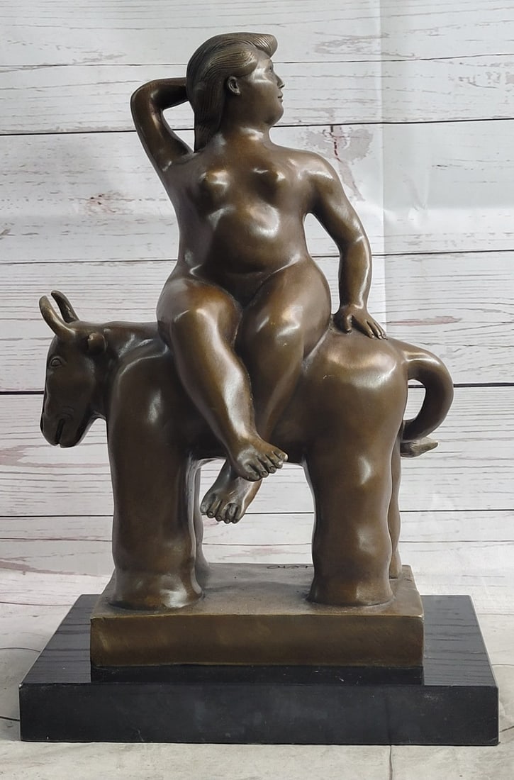 Modern Nude lady on Bull Bronze Sculpture: The bold woman rides on the back of a large bull, plump and confident, with her right arm behind her turned head. The sculpture was molded by using the lost wax casting method and finished with brown