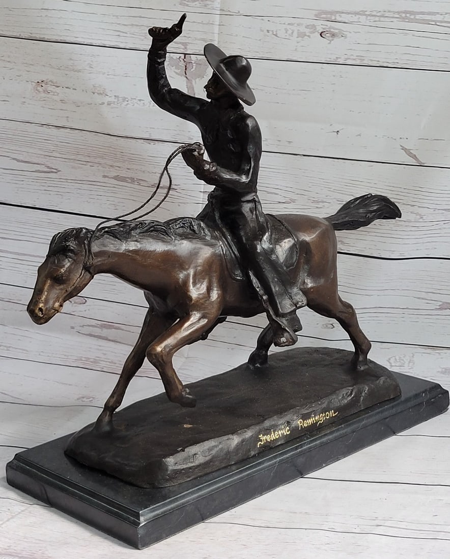 Cowboy Riding Bronze Sculpture: A seasoned cowboy is casually patrolling the area when suddenly something catches his attention. He yanks on the reins and his loyal horse charges forward. They gallop through the open dry plains as h