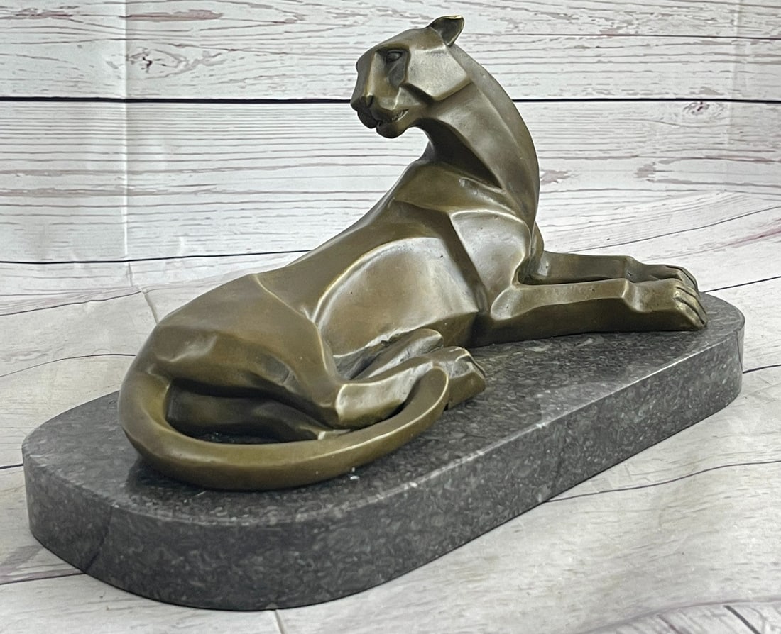 Animal Edition Lion Bronze Sculpture: Though the most feared and lethal predator of the jungle, the beauty of a lion is undeniable. This bronze sculpture includes the smallest details of the king of all wild cats, including the stretch of