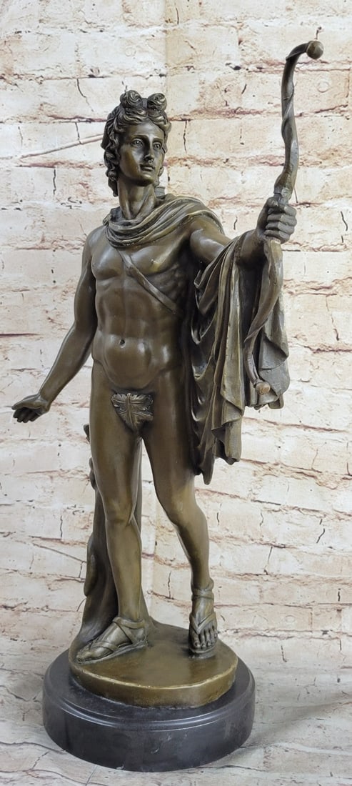 Nude Greek Bronze Statue: The young Roman man, having just stepped forward from behind a tree, gracefully lets his right-hand fall, after the release of his arrow. A long cape is fastened to his shoulder and has been swung ove