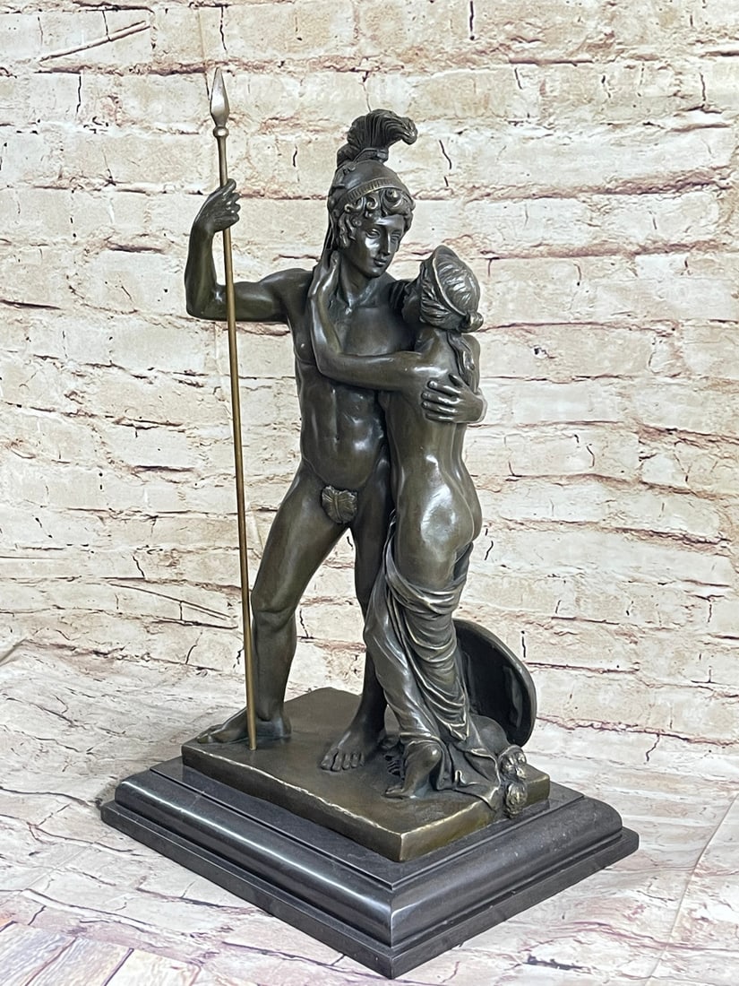 Greek Warrior Couple Bronze Sculpture: This sentimental piece features a nude Roman warrior standing fully erect, a sole leaf loosely placed between his legs. His decorative feathered helmet lets us know that he is a figure of power. A nud