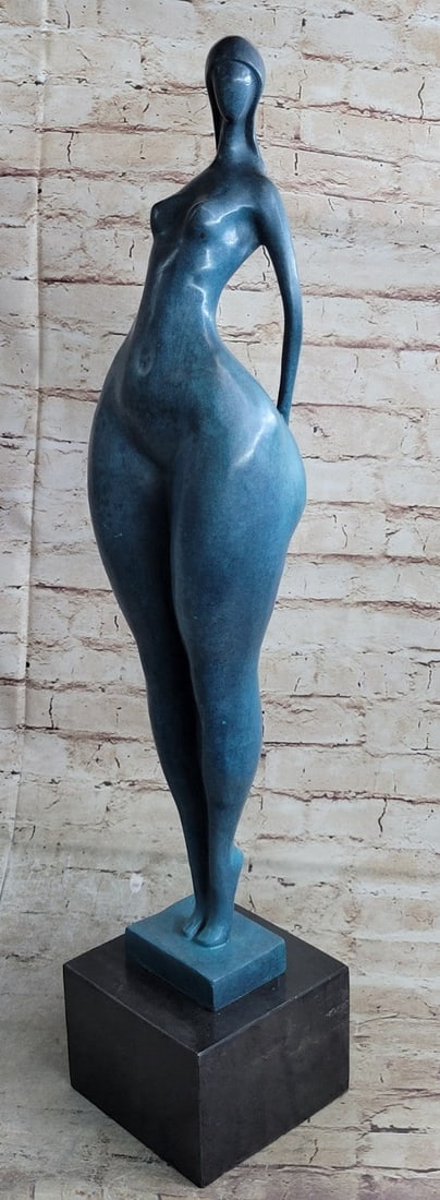 Nude Female Woman Bronze Sculpture: This is a fantastic Modern Art Nude Bronze on a marble base is a picture of a happily Standing nude female with very female proportions. This bronze sculpture was colored with a greenish patina on cre