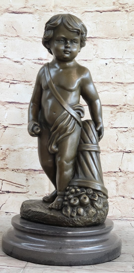 Nude Boy Holding Apple Bronze Sculpture: This child is on a mission. He has an almost adult-like expression on his face seared with determination and confidence. His hair appears smoothed and styled. The child is nude except for a cloth that