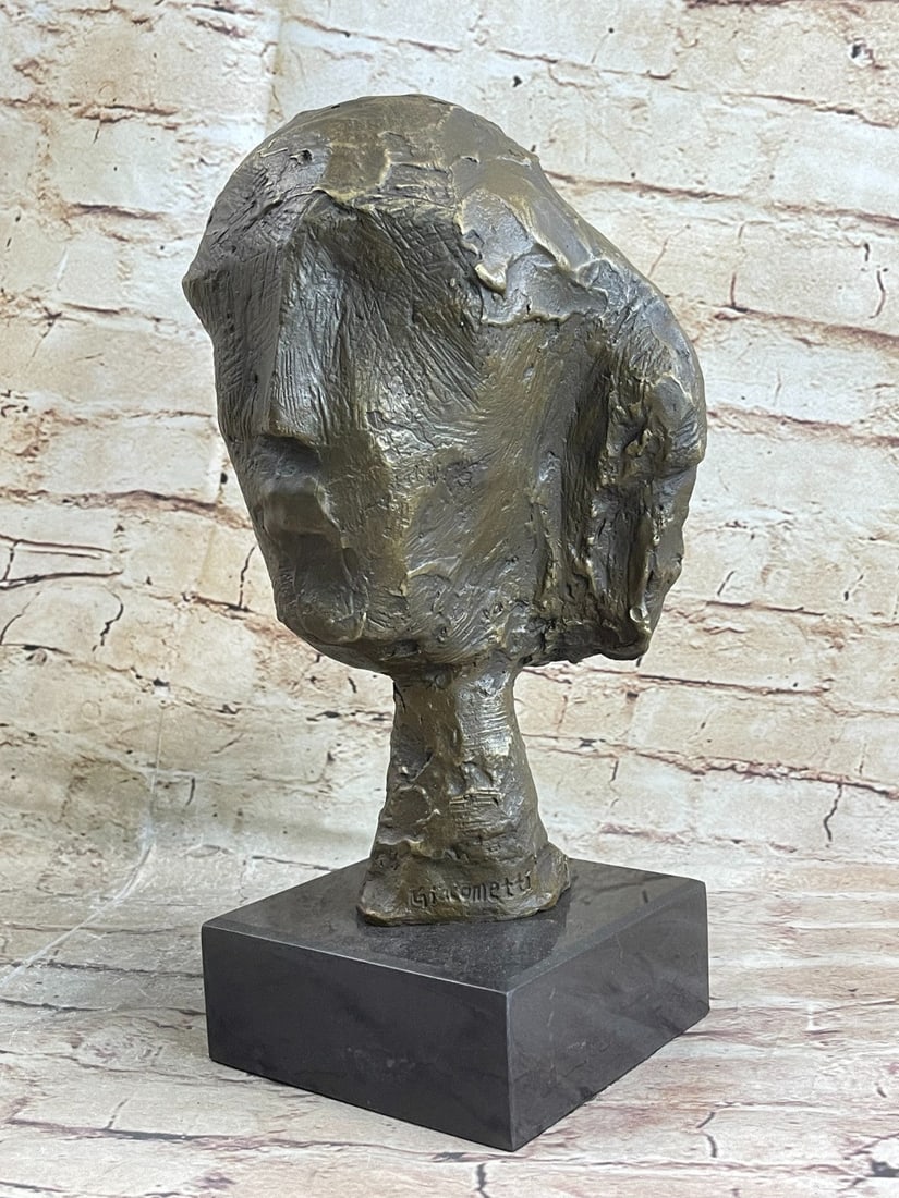 Woman of Venice Bronze Sculpture: The Abstract Bronze Head is modeled in the shape of the abstract sculptures of Gia Comment. The abstract and asymmetrical shape of the face and the compact rear part extracts itself from a short and f