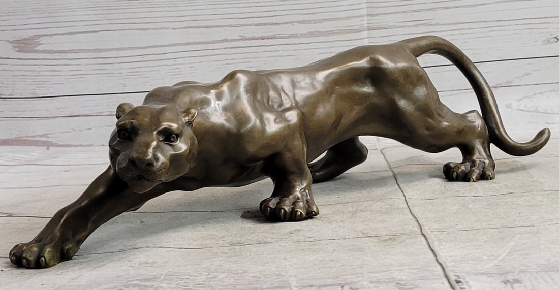 Sleek Cougar Lucky Bronze Sculpture: Her muscles flex as she walks across the open fields. This Sculpture draws you into the action and lets your imagination run wild as you join her on her walk across the wide-open plains of the outdoor