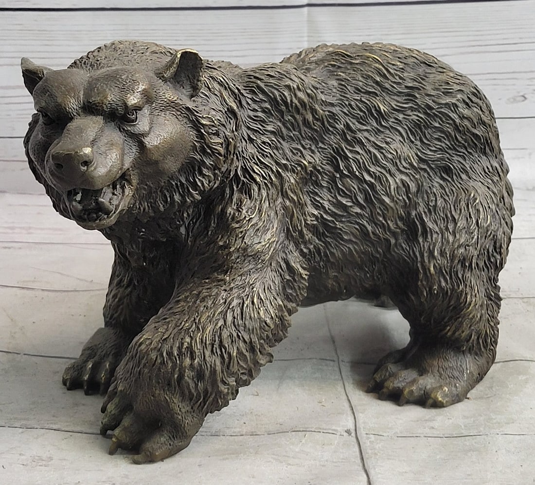 Ferocious Bear Wild Life Bronze Sculpture: A large and ferocious bear opens its mouth to let out a wild growl. Angry is apparent in its eyes as he frightens his prey or rival. His fur grows thick all over. This husky bear is a force to be reck