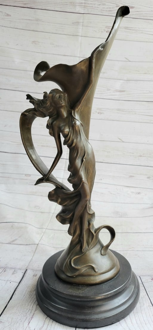 Nude Erotic Sexy Nymph Vase Bronze Sculpture: This beautiful bronze vase shows a beautiful nymph raising her hand accompanied by a bundle of flowers and vines. This vase severs as a multipurpose. This vase has an art nouveau feel and can truly br