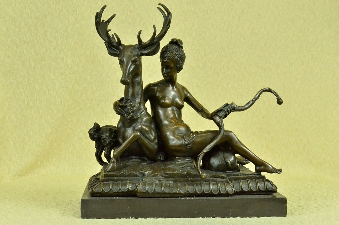 Artemis Greek Goddess of Hunt Wild Animal Bronze Sculpture: The bronze sculpture is of the Hellenic deity, Artemis, goddess of the hunt, wild animals, wilderness, childbirth, virginity, and young girls, bringing and relieving disease in women. The deer and the