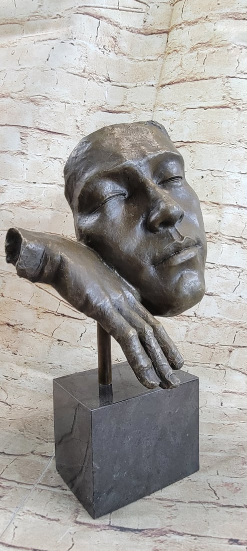 Resting Man Bronze Statue: The man rests on his hand, while he sleeps he dreams of only the fine things in the world The bronze sculpture was captured using the ancient method of lost-wax casting and stained with a brown patina