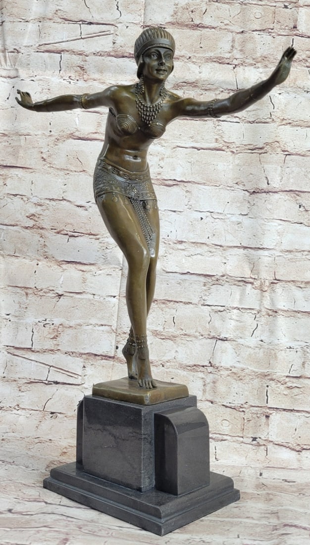 Exotic Dancer Bronze Sculpture: This bronze is entitled 'Phoenician Dancer' she stands on her toes and dances with her legs close together and bent. This is an extremely detailed piece right down to the tone of her stomach muscles.