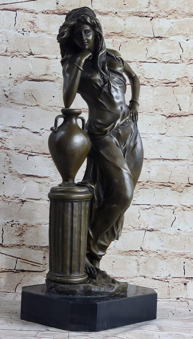 Maiden Ponders Leaning against Column Bronze Sculpture: A beautiful maiden ponders while leaning against a column. She rests her head on her fists and stares timidly out in front of her. She has long pretty hair that falls past her shoulders. The fabric of
