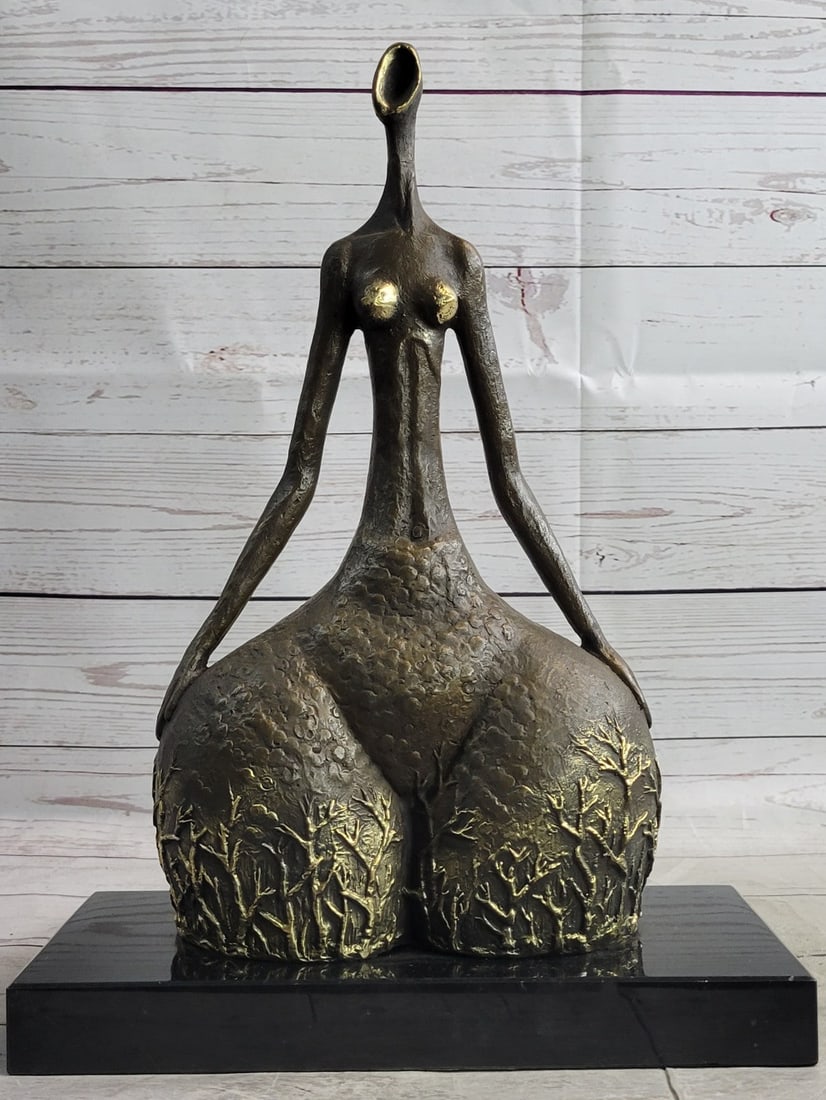 Dancer Bronze Sculpture: An abstract female dancer sculpture. This is a powerful dancer in the sharpness of her position. This wonderfully curvaceous woman bears the wide hips commonly attributed to femininity and fertility.