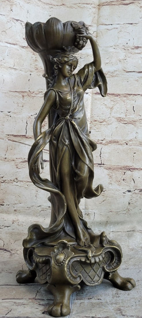 Mythology Sexy Woman Bronze Candlestick: This candelabra is a superb reproduction from the past. This Bronze Sculpture is cast using the ancient Lost Wax Method in brown patina and mounted atop a marble base. Dimensions: Height 13 X Width 5