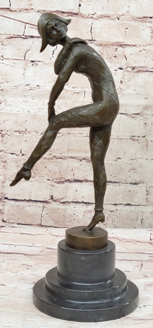 Dancer Bronze Sculpture: This lovely sculpture of a woman dancing across the stage is astonishingly beautiful. She wears this full-body one-piece that is skin tight and suits her very well. She wears a hat that looks like the