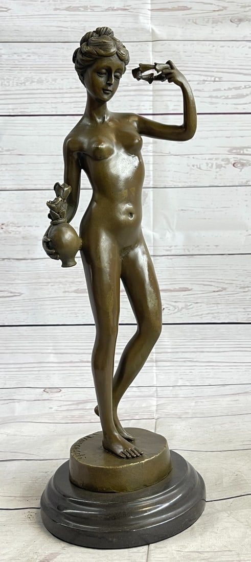 Nude Girl Joyful Dancing Bronze Statue: She is comfortable standing before his easel and being the inspiration for the strokes of his paintbrush. She poses with the items has given her as props. She cradles one on her hip and holds the othe