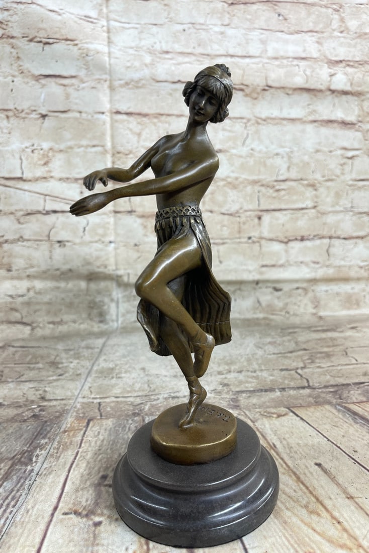 Dancer Bronze Sculpture: The feeling of motion and excitement is conveyed by the dancer's Costume, gesture, and facial expression. Smooth quality chasing of the figure. This bronze sculpture was crafted using the lost wax met