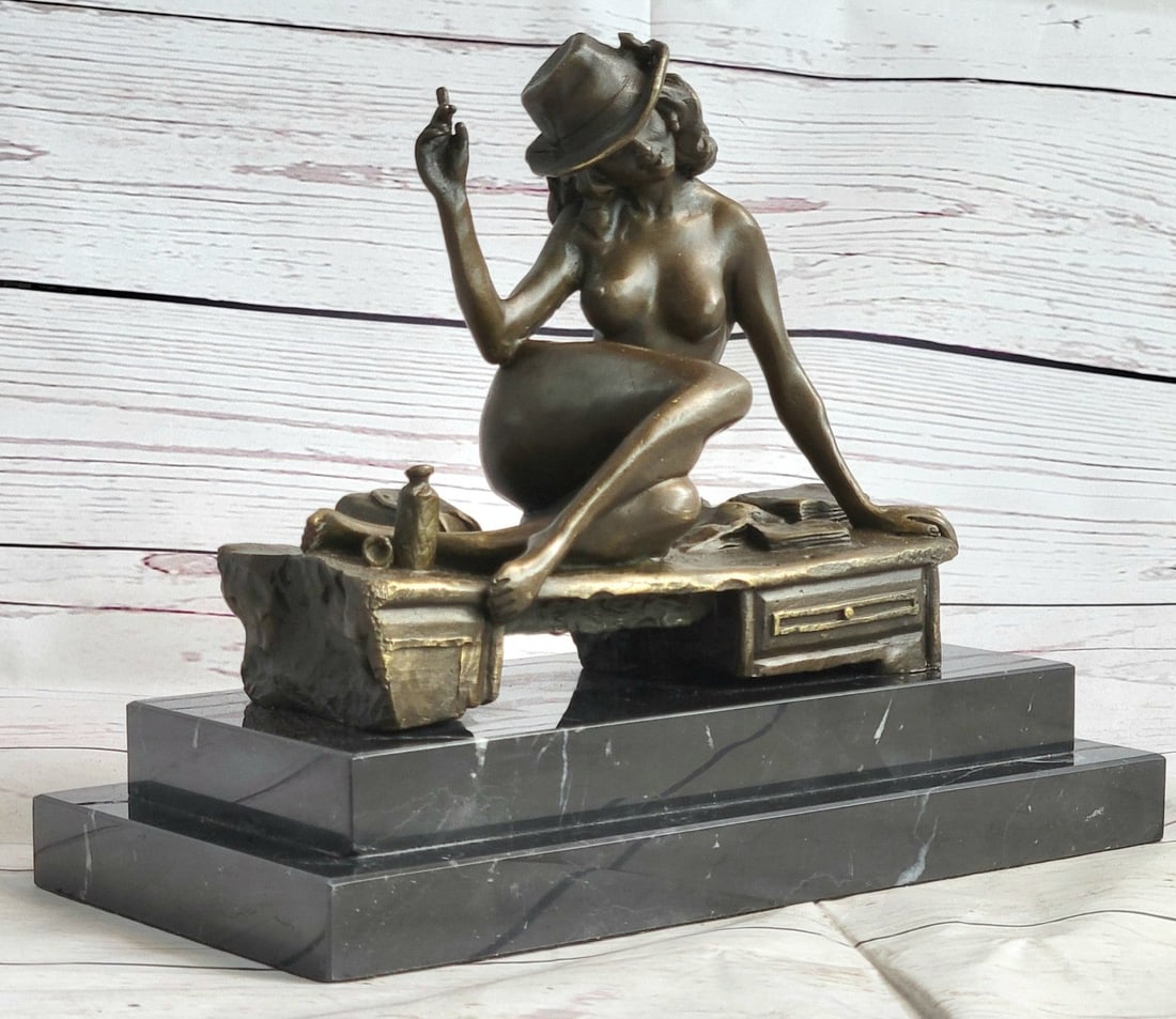 Burlesque Dancer with Hat and Cigar Bronze Sculpture: With style, grace, and ease she leans back while she is lying seductively on a bench, wearing her lover's hat and holding a cigar while tilting her head in a suggestive manner. This sultry Lil burlesq