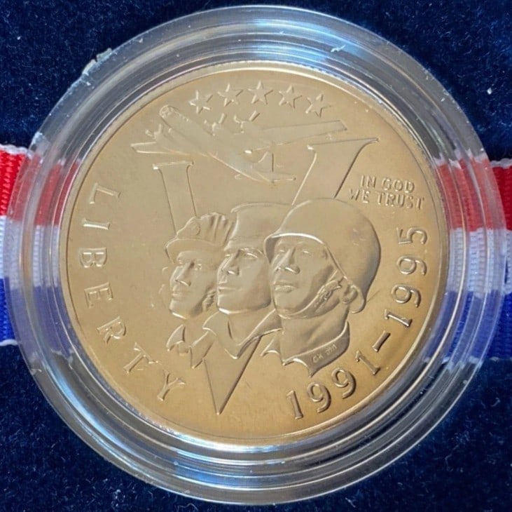 1991–1995 World War II 50th Anniversary Proof Clad Half Dollar – Original Box & COA: This World War II 50th Anniversary Commemorative Proof Clad Half Dollar was issued by the United States Mint between 1991 and 1995 to honor the service and sacrifice of those who served during World