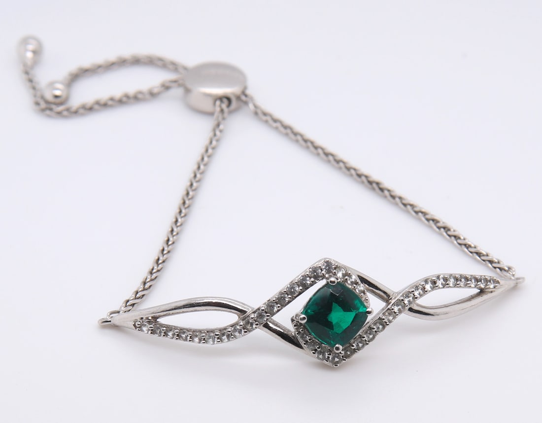 Sterling Silver Green and White Cubic Zirconia Bracelet: 925 Sterling Silver Green and White Cubic Zirconia Bracelet. Total weight of Bracelet 9.14 Grams.