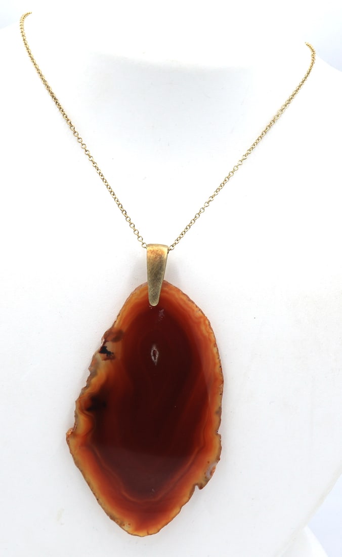 Brown Agate pendant on chain: Brown Agate pendant on 30 inches gold plated chain necklace. Total weight of necklace is 27.4 grams.