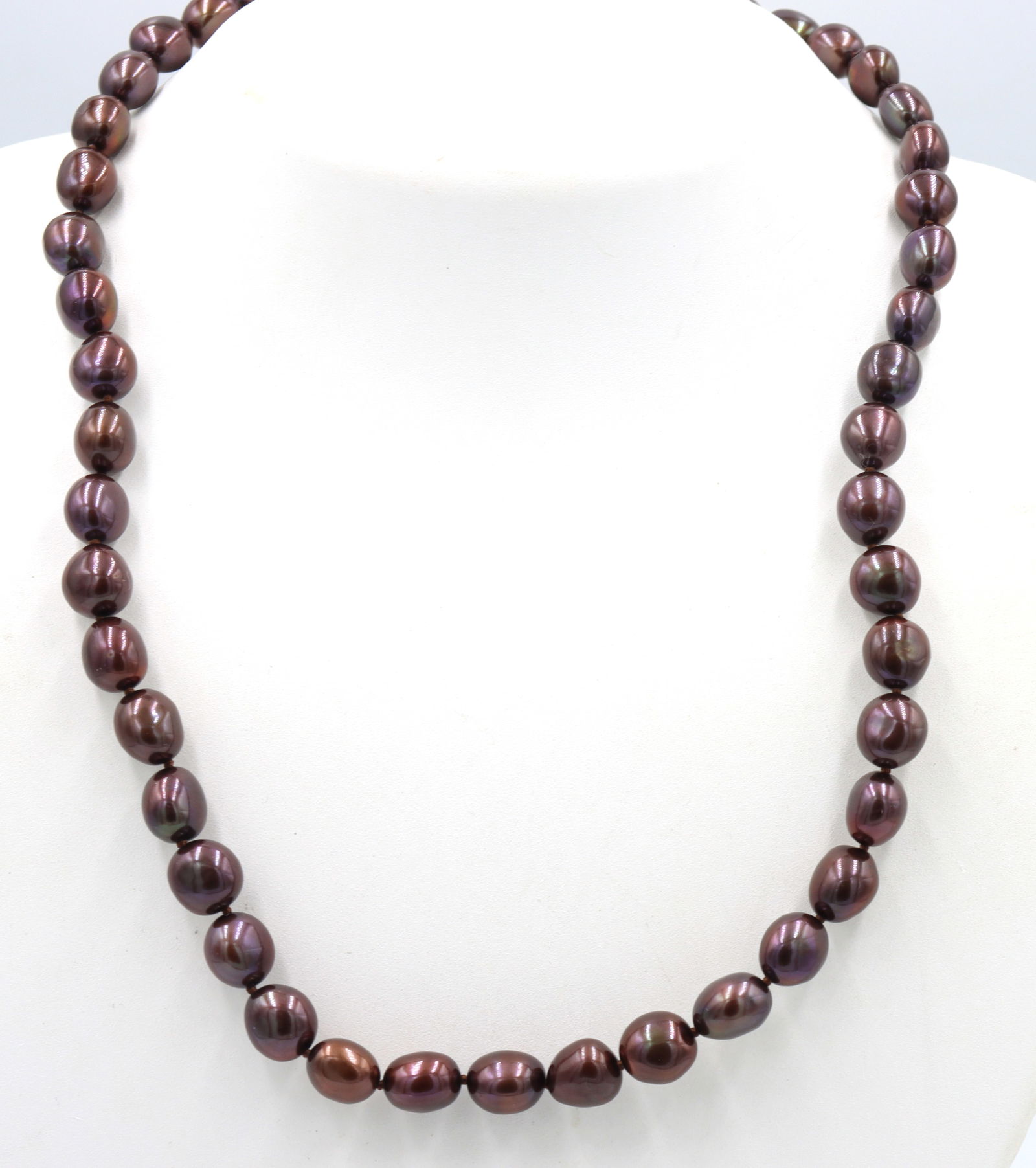 Honora brown pearl necklace: Honora brown pearl strand 17 inches necklace with 925 sterling silver clasp. Total weight of necklace is 37.4 grams.