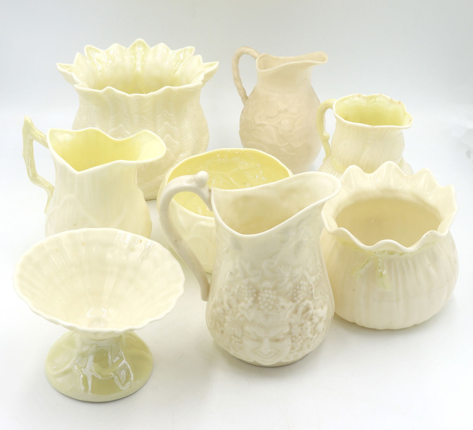 Group lot of 8 Belleek Ivy yellow mini creamer and bowls: Group lot of 8 Vintage Irish Belleek Ivy signed yellow mini creamer and bowls.
