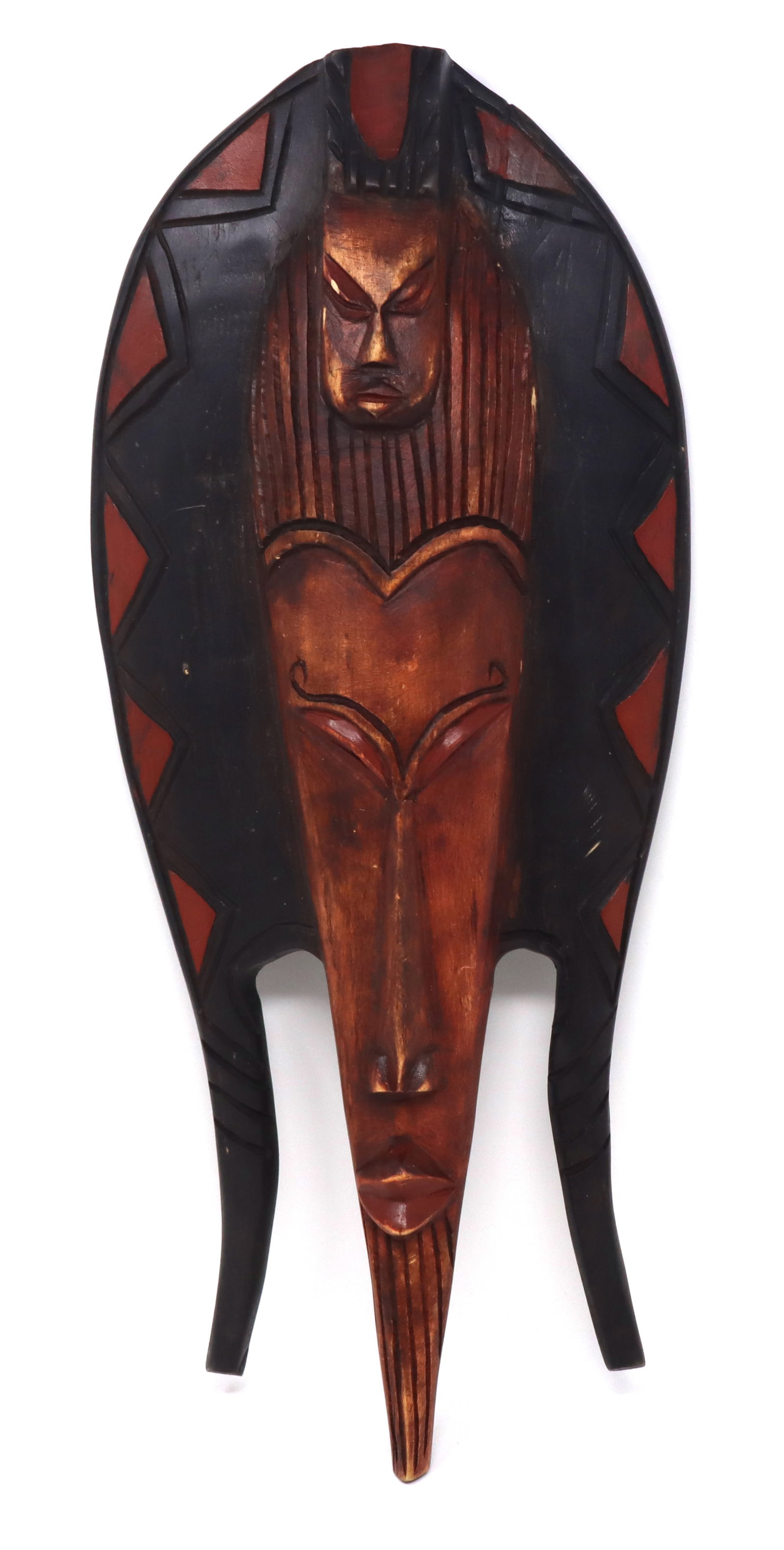 African wood wall mask: African wood wall mask design carved by hand. 19 inches tall.